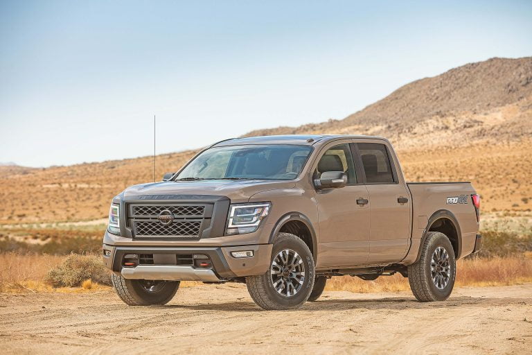 Tan coloured Nissan truck in deserted landscape