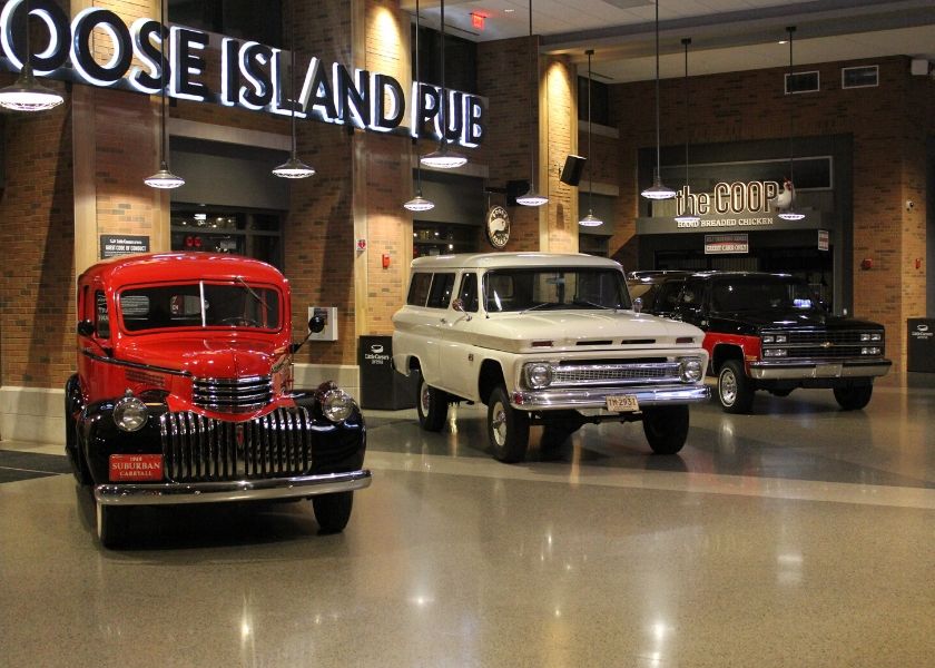 Three classic Suburbans on display.