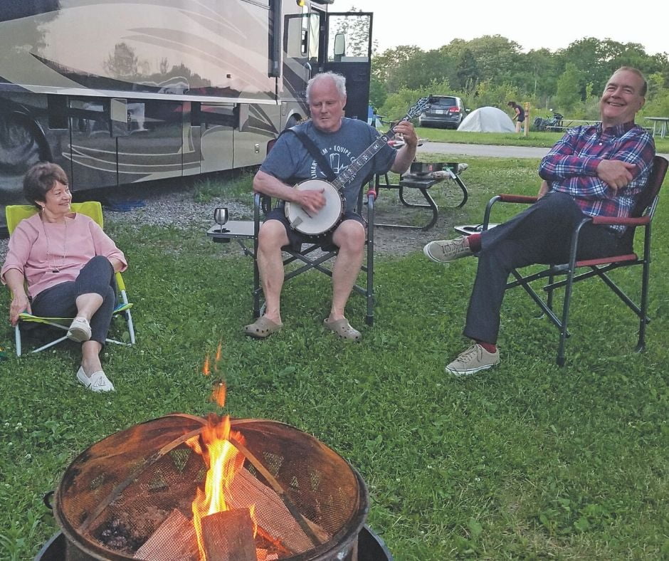 Hanging out by the camfire, playing a banjo