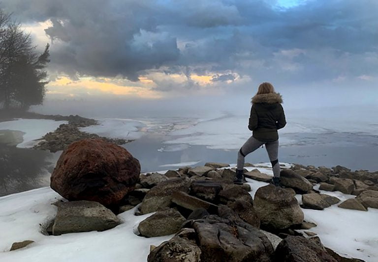 Person standing on rocks