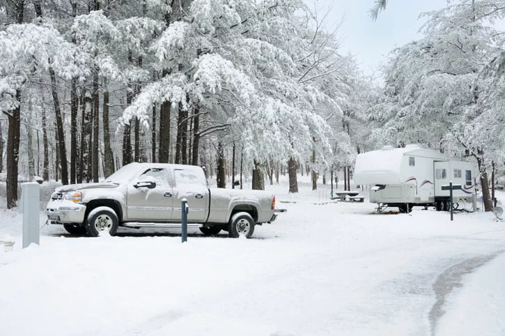 Pick up truck and trailer in the snow