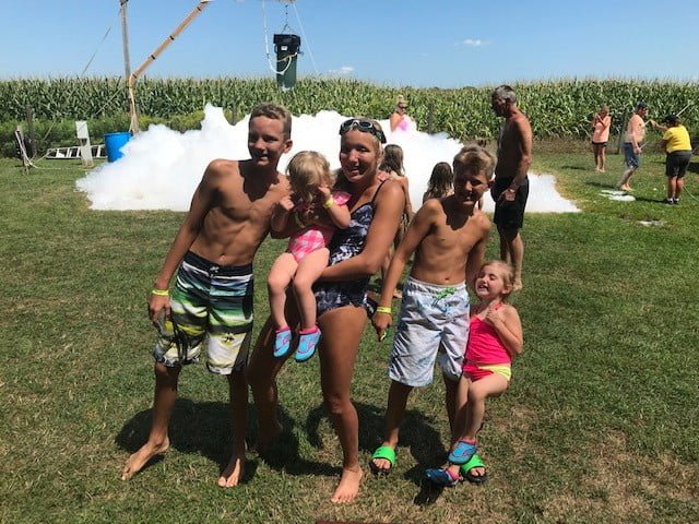 kids playing at a foam party