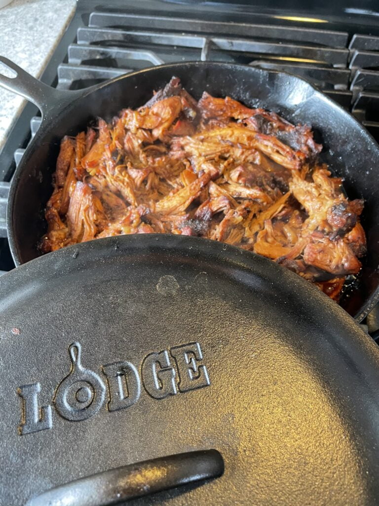 Meat cooking in a Lodge Cast Iron Dutch Oven