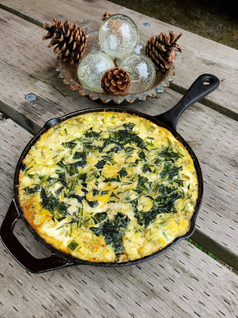 Frittata cooling in a cast iron pan.