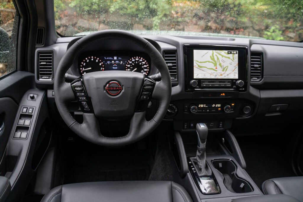 The steering wheel and touch screen in a 2022 Nissan Frontier.