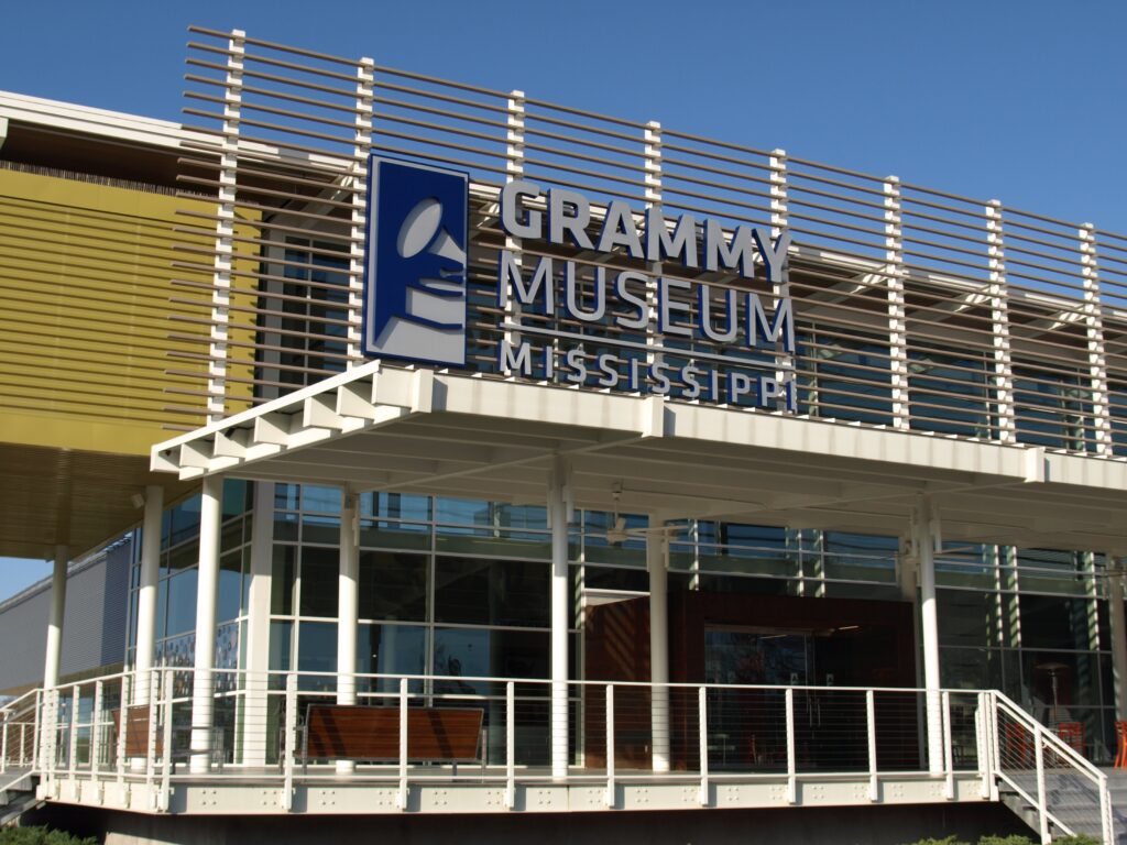 Exterior of modern building with Grammy Museum sign.