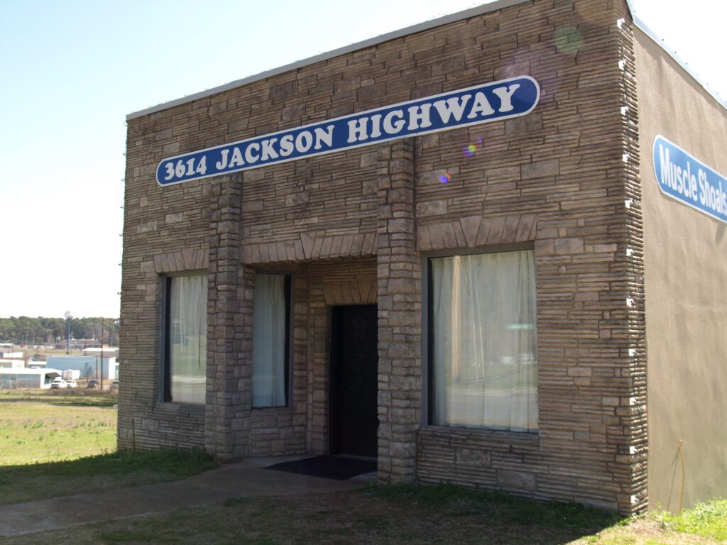 Exterior of 3614 Jackson Highway – grey square building.