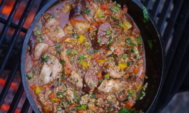 Cooked Jambalaya in a cast iron pan.