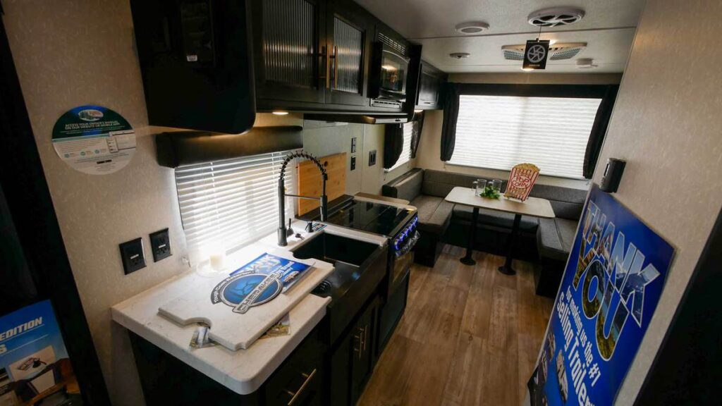 View of the kitchen and U-shaped dinette in the Cherokee Grey Wolf RV.