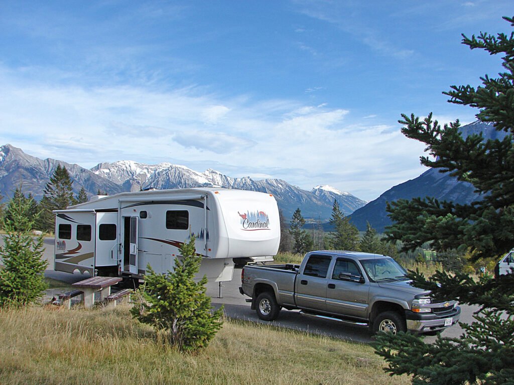 Truck pulling a trailer parked in Banff National Park.