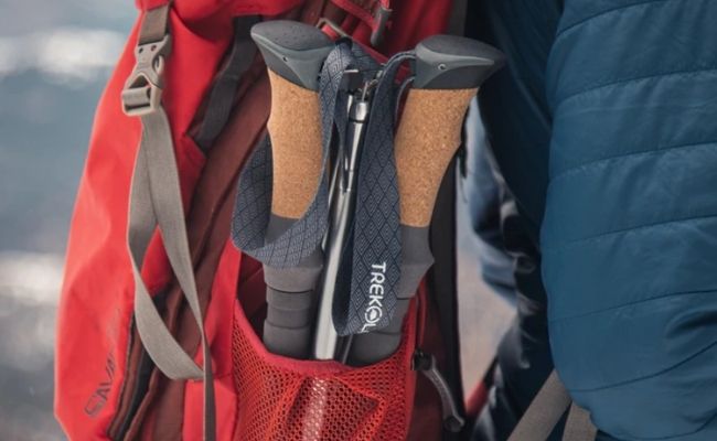 Trekology foldable trekking poles folded in a backpack.