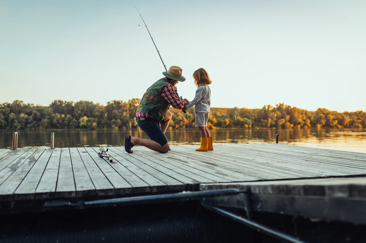 Grandfather and grandchild on a fishing adventure.