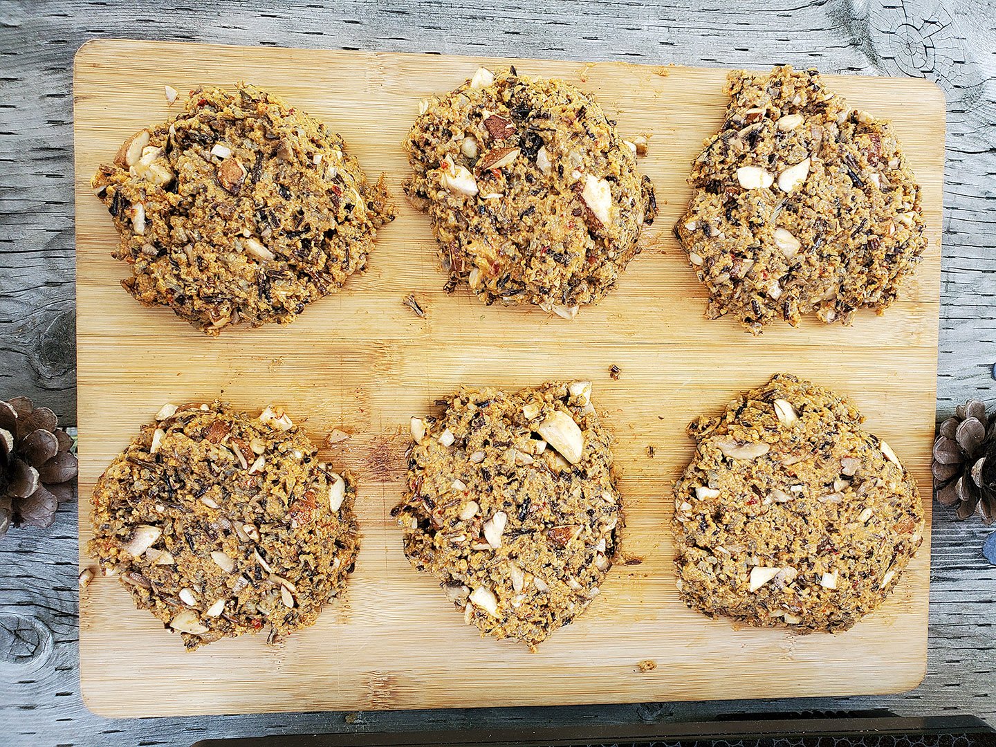 Wild rice burger patties formed on a cutting board. 