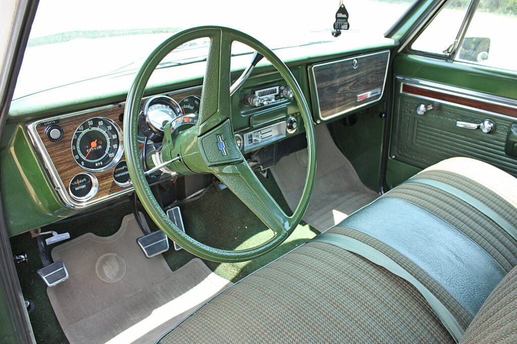 View of the steering wheel and front dash inside a Chevy Cheyenne Super10, considered by many to be Chevrolet’s most beautiful pickup trucks.