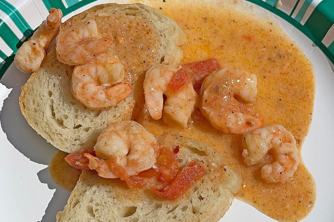 Shrimp appetizer over bread. 