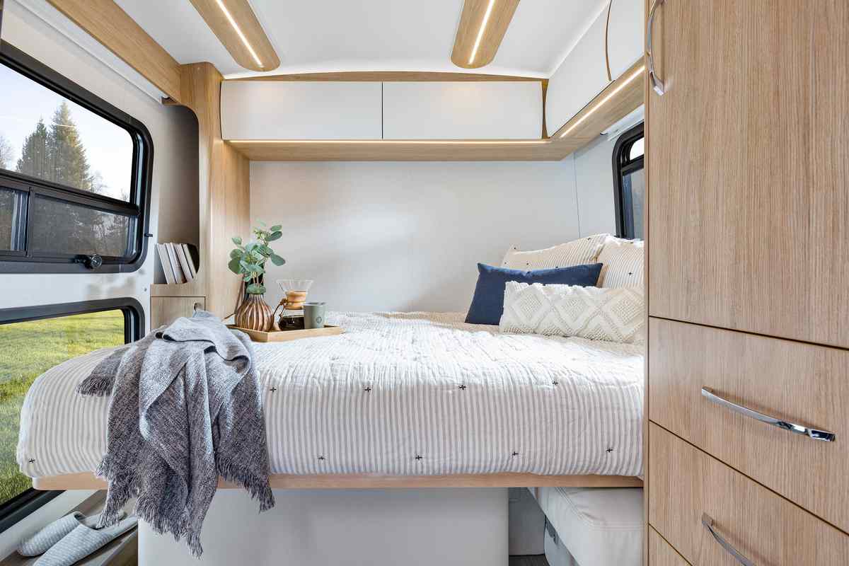The Wonder Class B-Plus motorhome’s murphy bed pulled down, transforming the lounge area into a master suite.