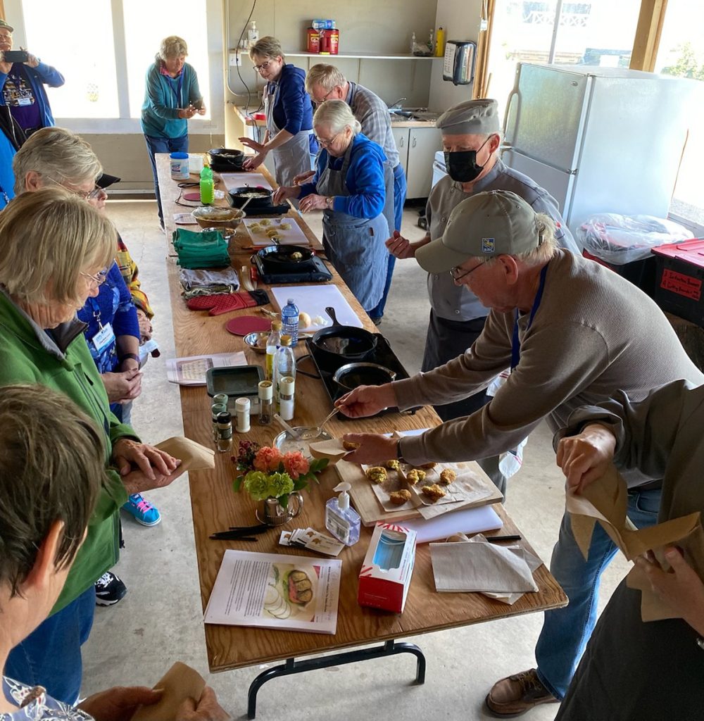 Members of the Explorer RV Club gather for a cooking lesson at the 2022 Rally.