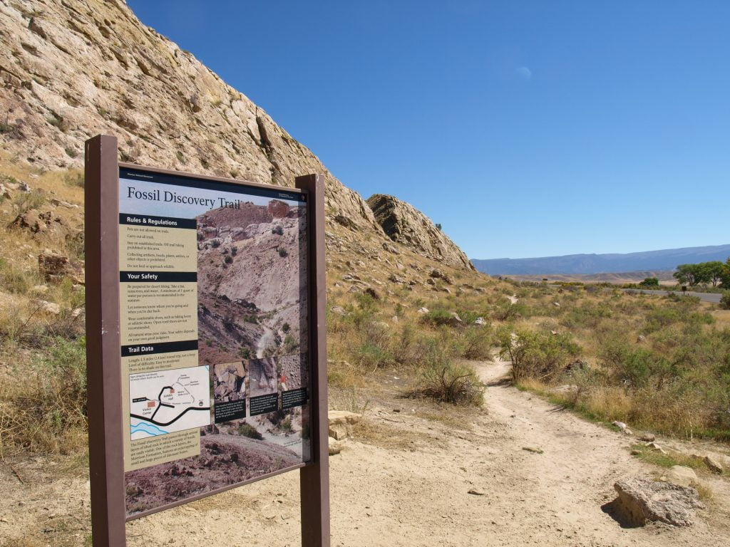 Fossil Discovery Trail entrance sign on a dirt road
