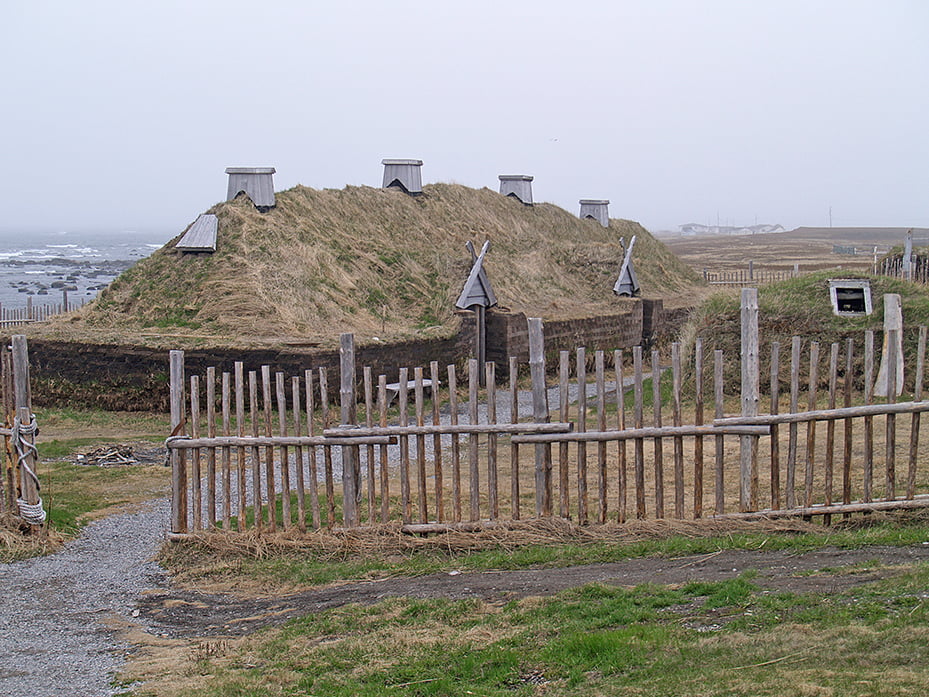 A turf-walled house, which could be mistaken for a grassy hill if it wasn’t for the doors and chimneys, is part of the remains of a Viking settlement in Newfoundland.