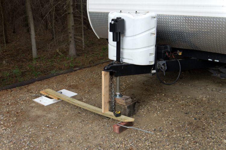 An image of a trailer hitch and a weight scale.