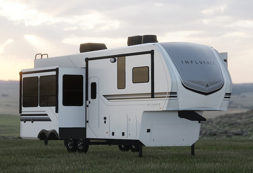 This RV is slick and almost futureistic in appearance. The white RV has some black and tan accesnt but the most stunning aspect is the perfectly curved front. The RV has a pop out side room accent open.