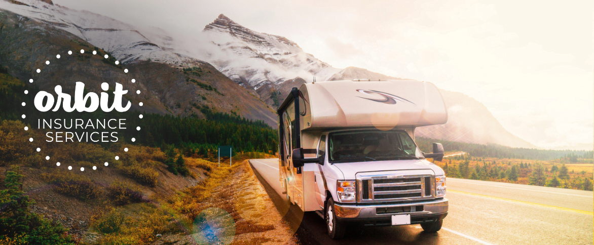 RV parked on the side of a road by snow mountains with an orbit logo to the left of the RV.