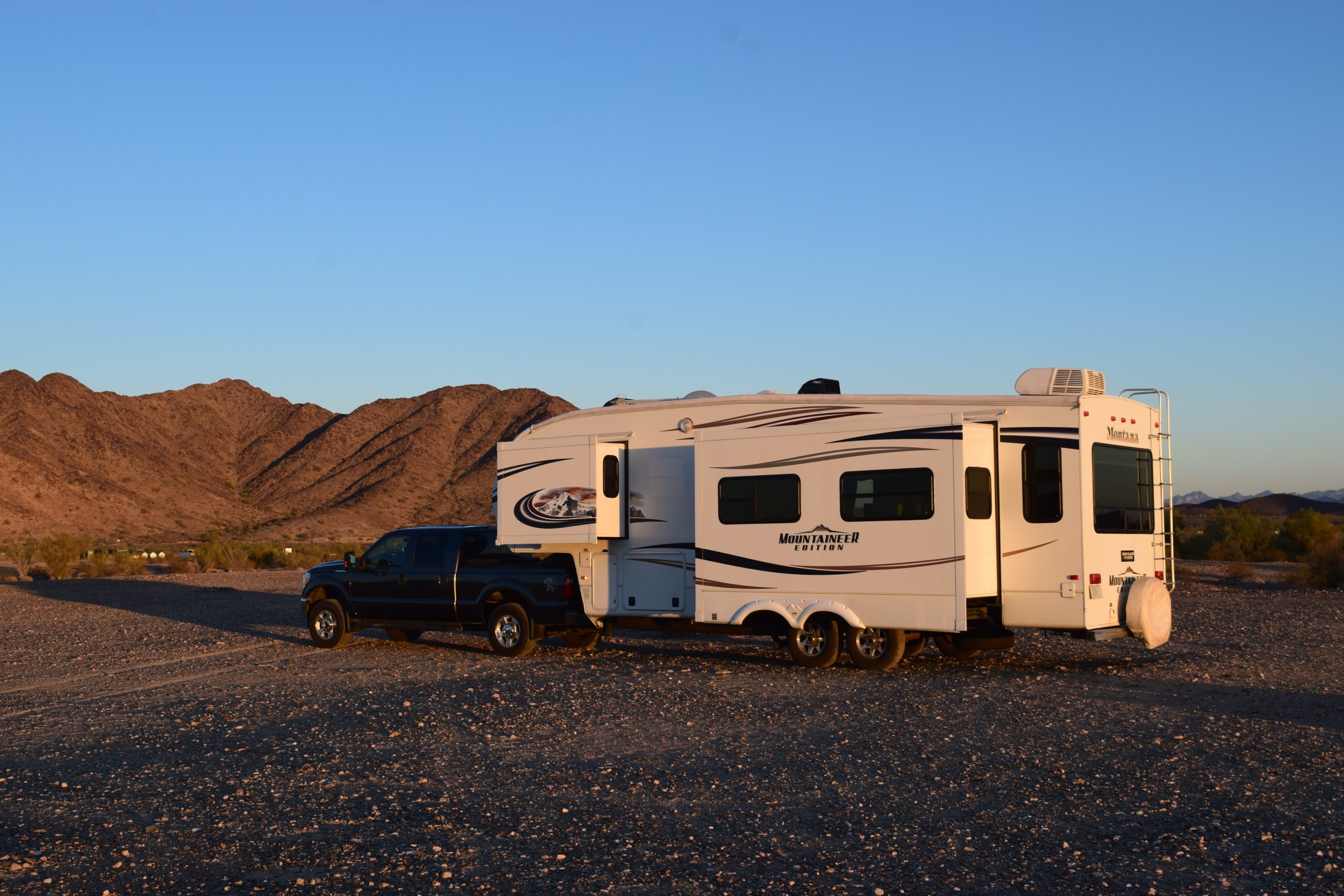 A 5th wheel RV sits on its own on the BLM property West of Quartzsite Arizona.