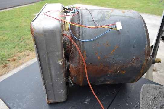Old water heater removed from trailer.