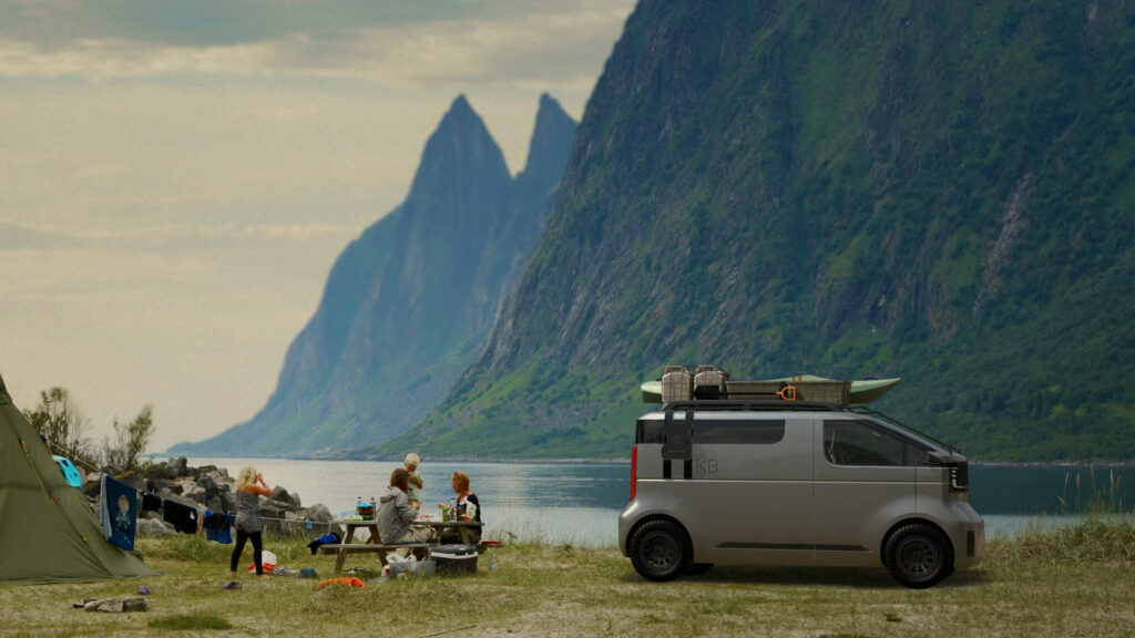 Toyota Kayoibako parked by a lake surrounded by mountains