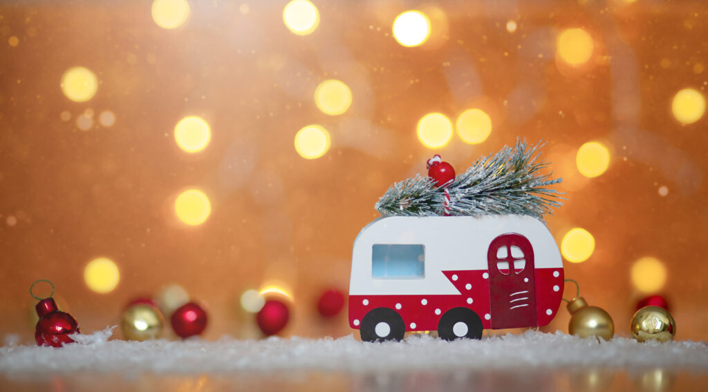 Toy trailer with holiday decorations around it