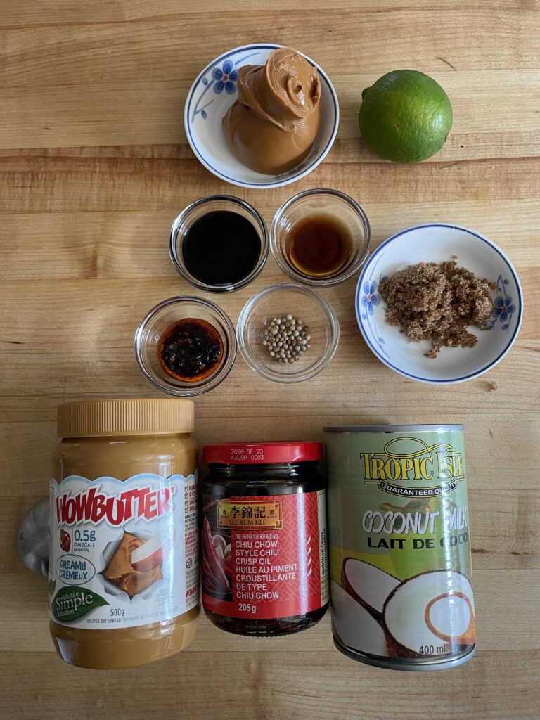 Clockwise from WOWBUTTER, lime, brown sugar, coriander, chili crunch, tamari, and fish sauce.