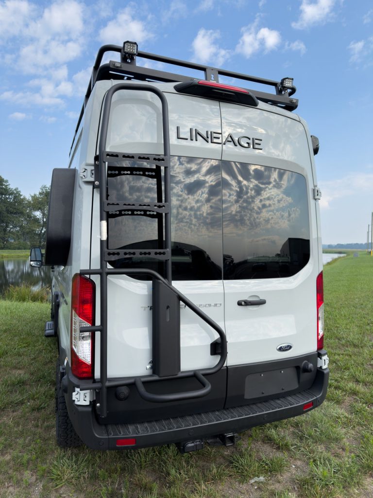 Back view of the Grand Design Lineage Series VT showing the ladder attached to the back of the motorhome.