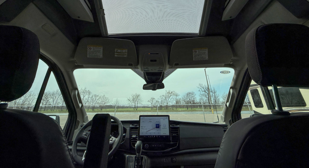 A view of the cockpit in the 2026 Grand Design Lineage Series VT with the sunroof.