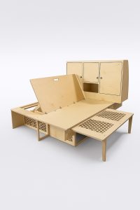 Bench, bed and cabinet on a white backdrop.