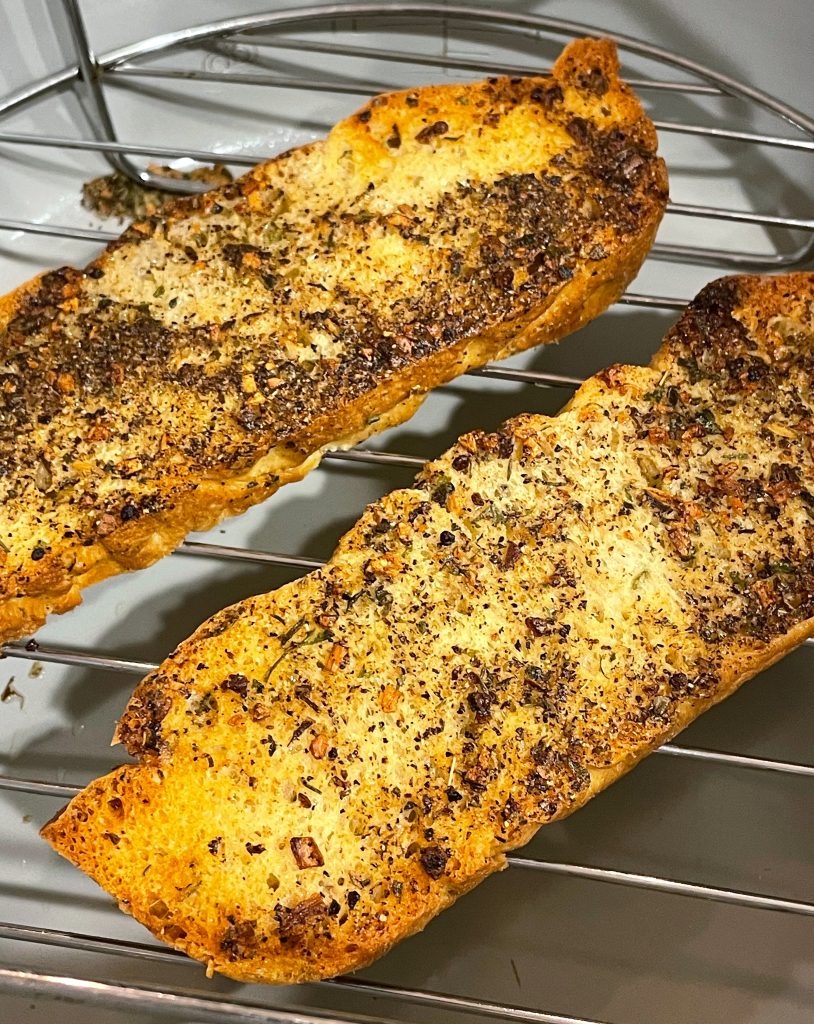 Two pieces of baked bread to use for croutons.